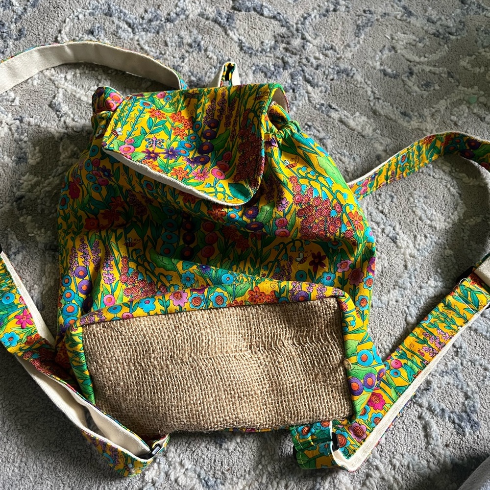 Unique floral and straw knit back pack boutique